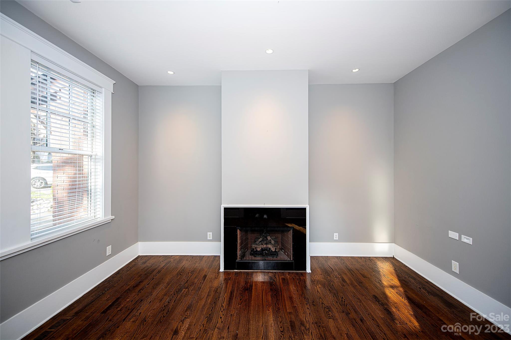 1403 Devon Drive Charlotte, NC 28209 - Photo 24 of 46 wooden floor in an empty room with a window