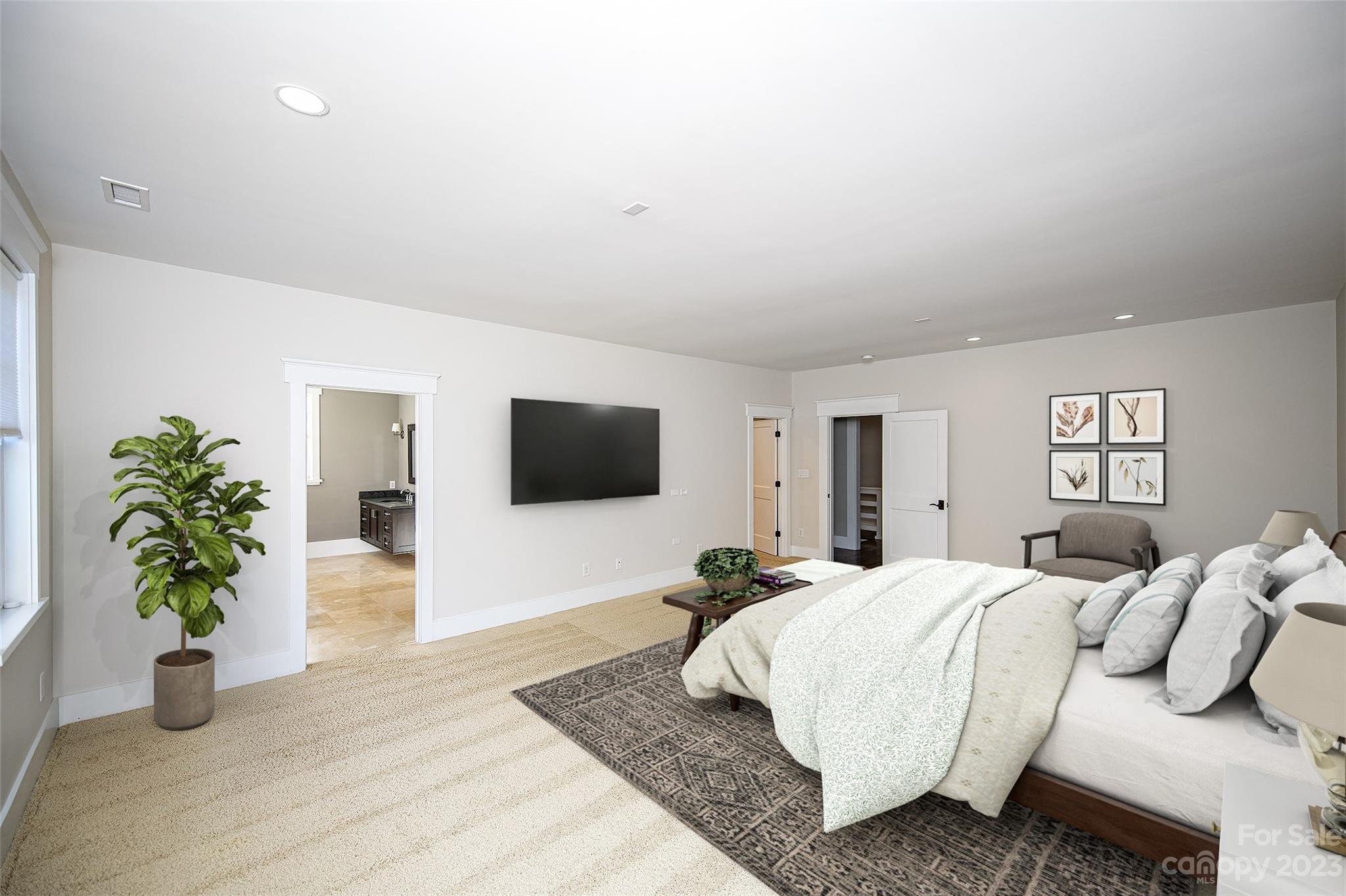 1403 Devon Drive Charlotte, NC 28209 - Photo 28 of 46 a bedroom with a bed a couch and a potted plant