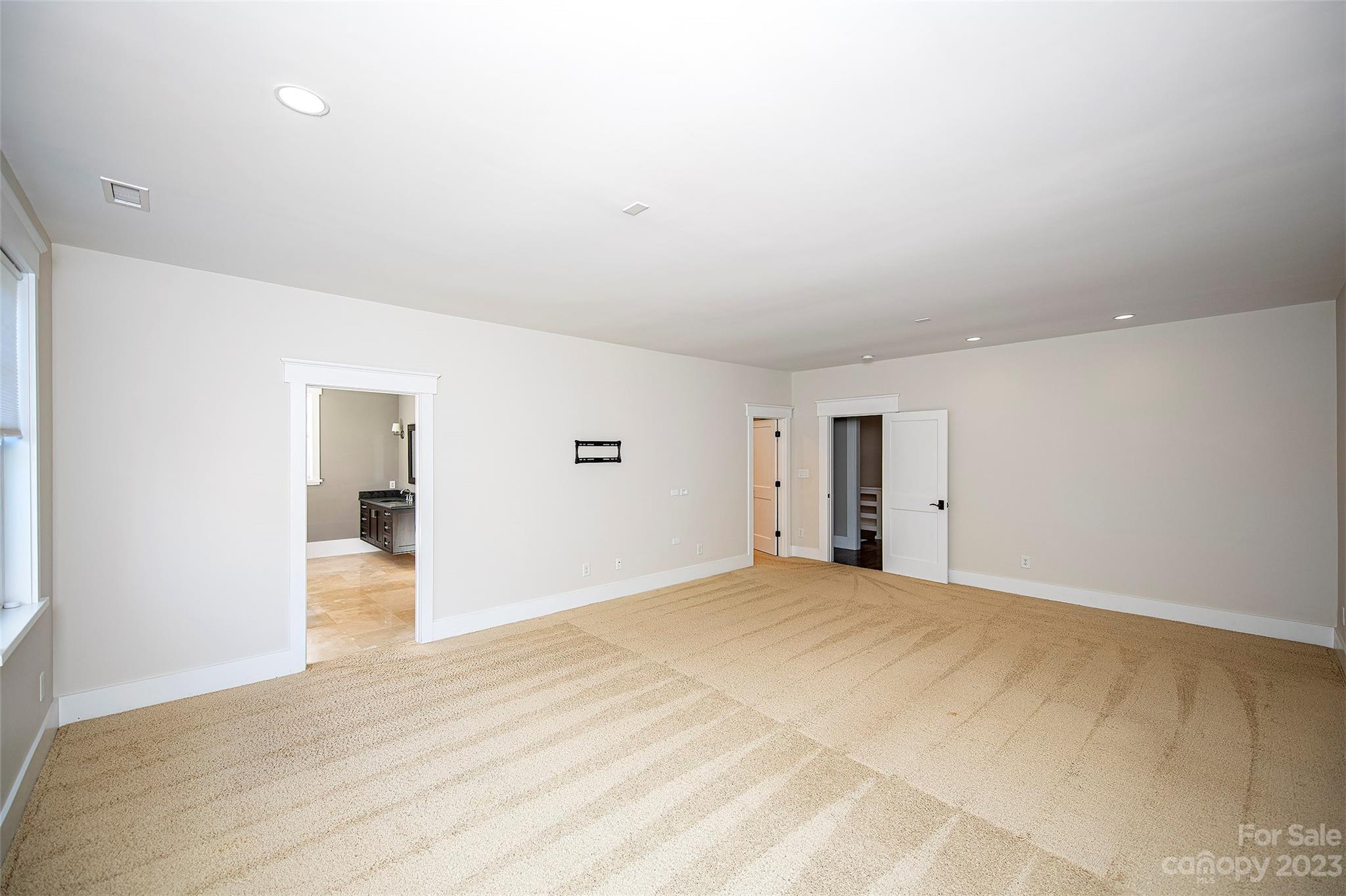1403 Devon Drive Charlotte, NC 28209 - Photo 29 of 46 a view of empty room with wooden floor
