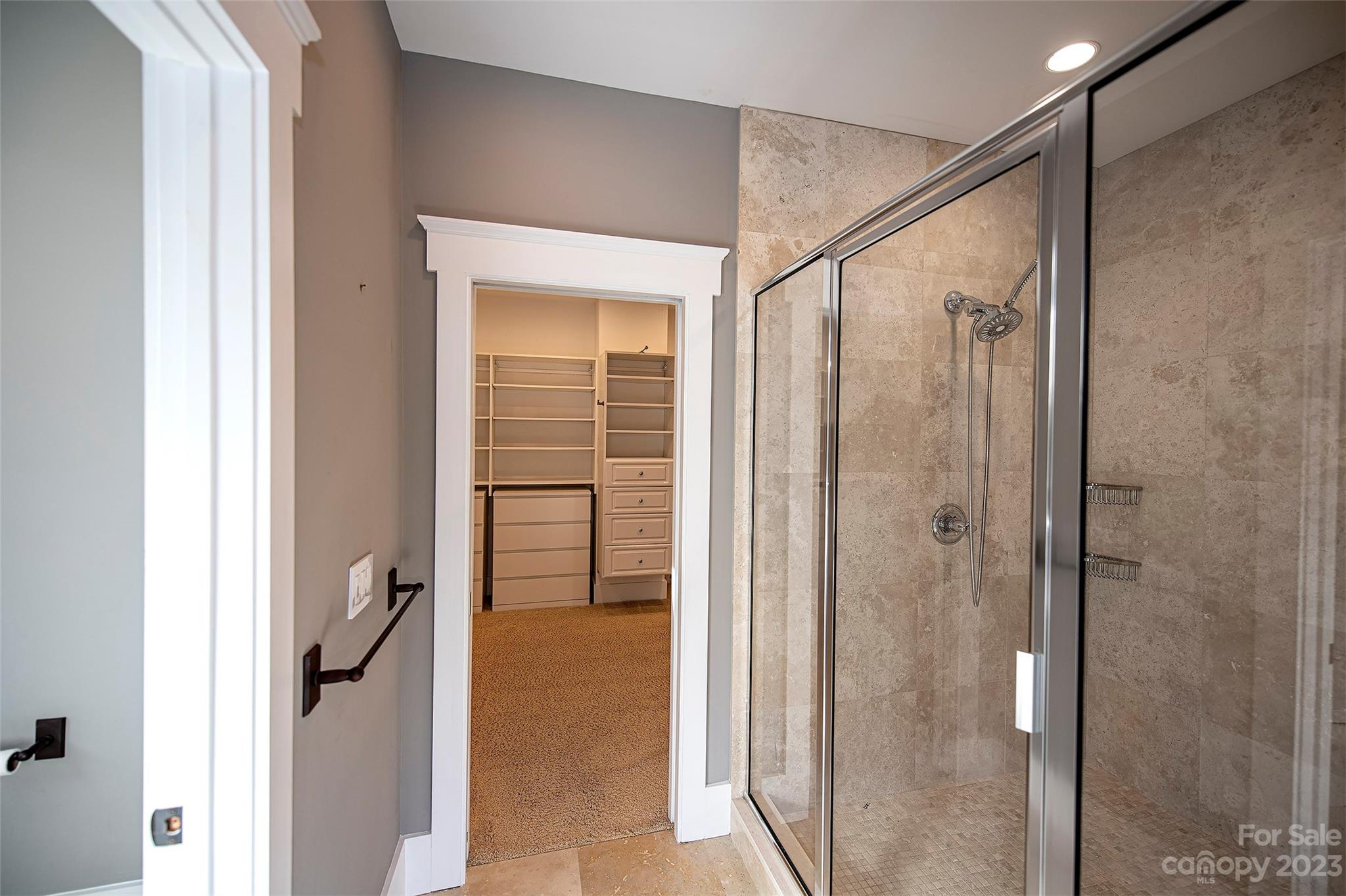 1403 Devon Drive Charlotte, NC 28209 - Photo 32 of 46 a bathroom with a shower and a glass door