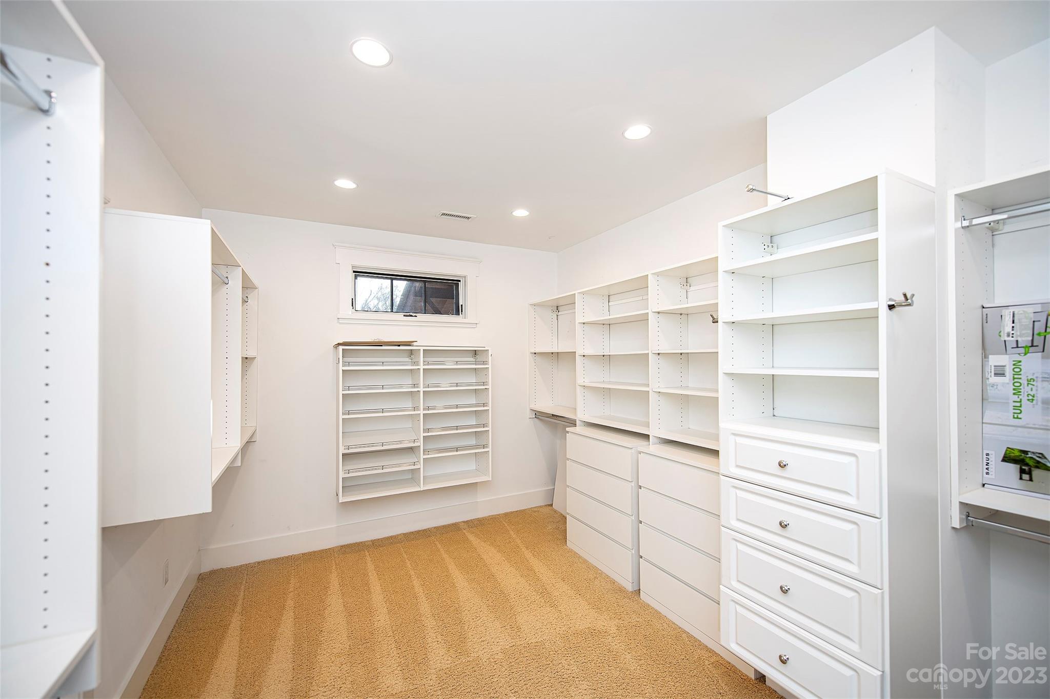 1403 Devon Drive Charlotte, NC 28209 - Photo 34 of 46 a view of a bedroom with cabinets and window