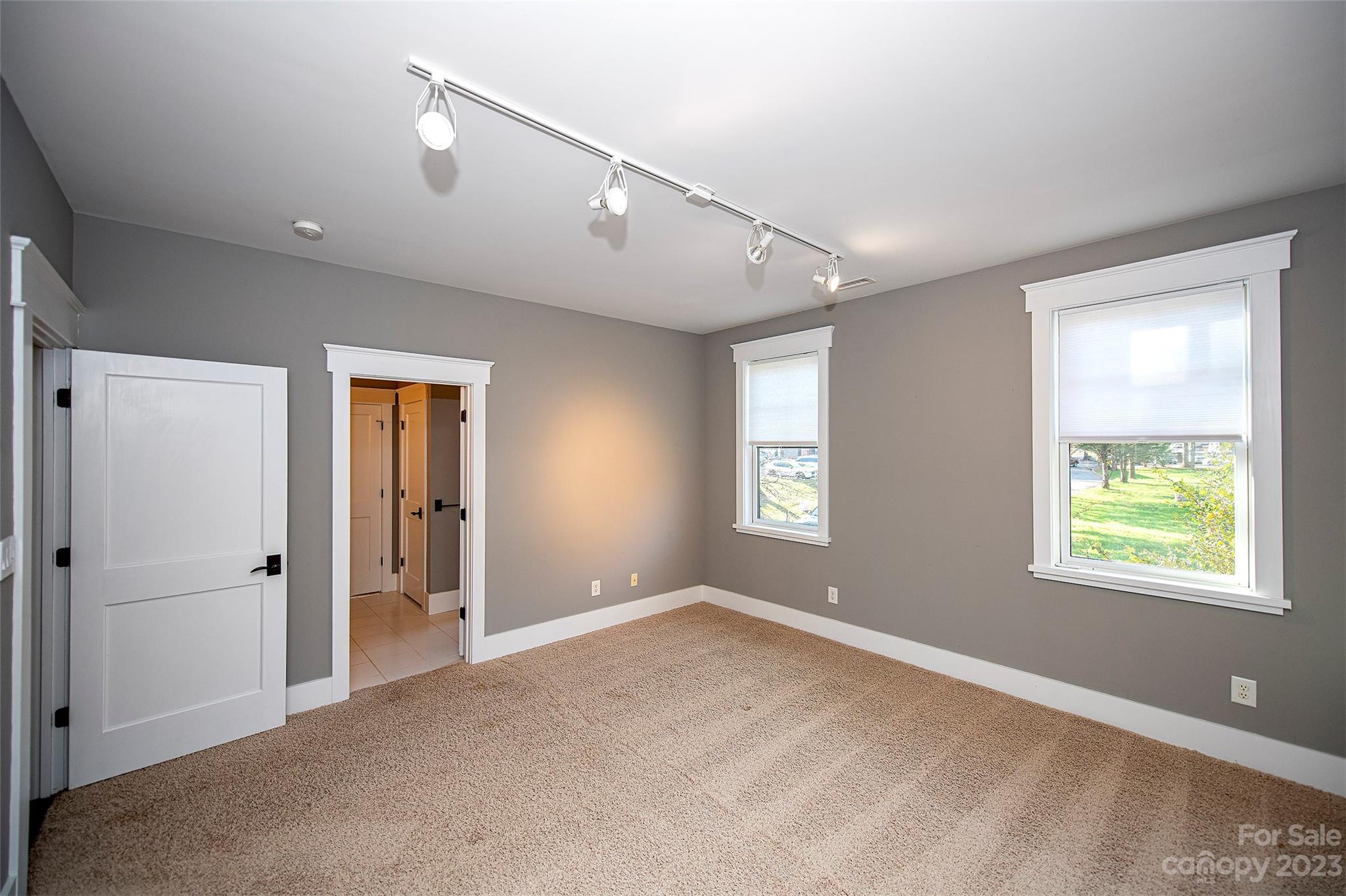 1403 Devon Drive Charlotte, NC 28209 - Photo 37 of 46 a view of an empty room with window and a bathroom
