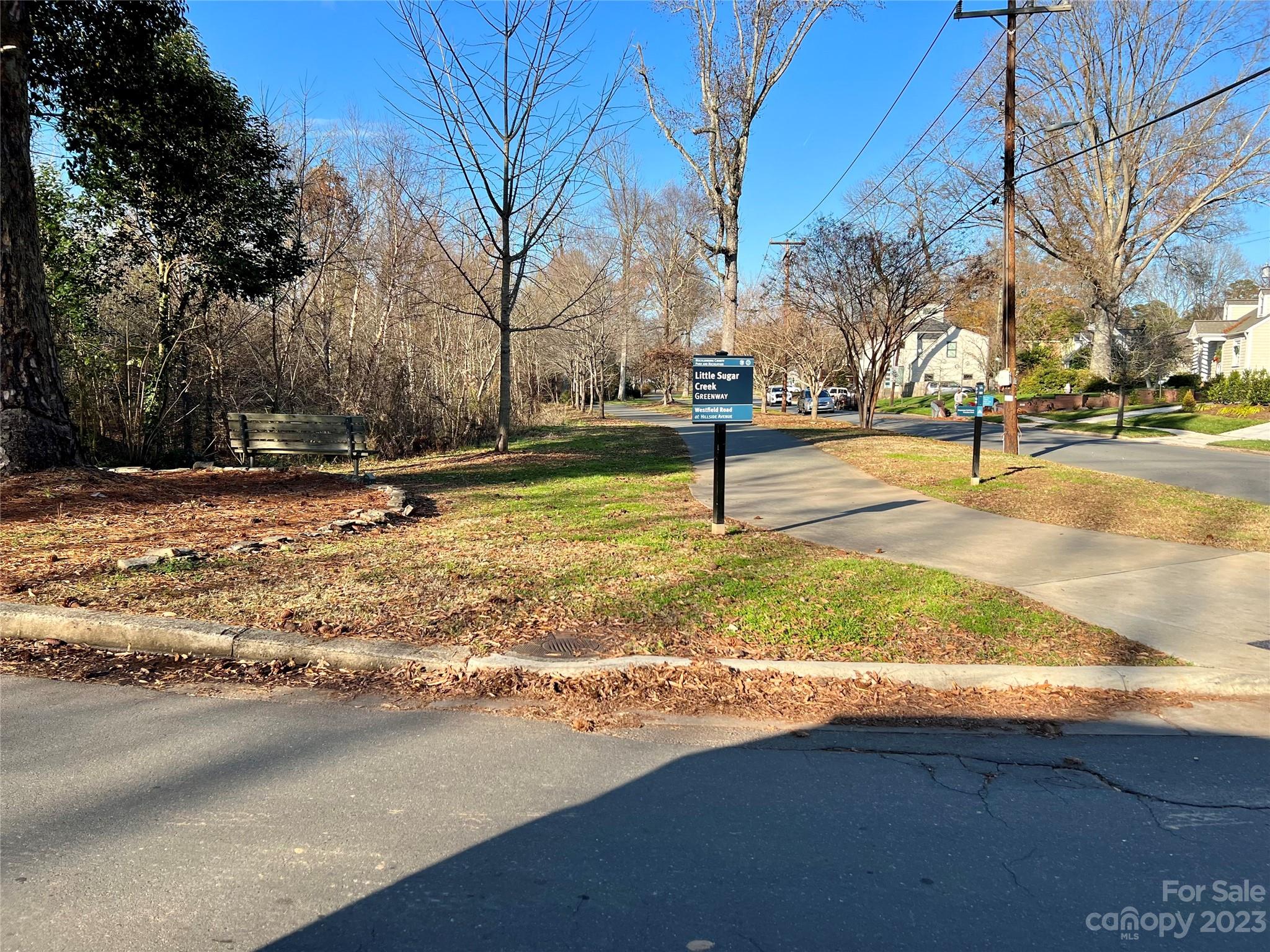 1403 Devon Drive Charlotte, NC 28209 - Photo 44 of 46 a view of a yard with a tree