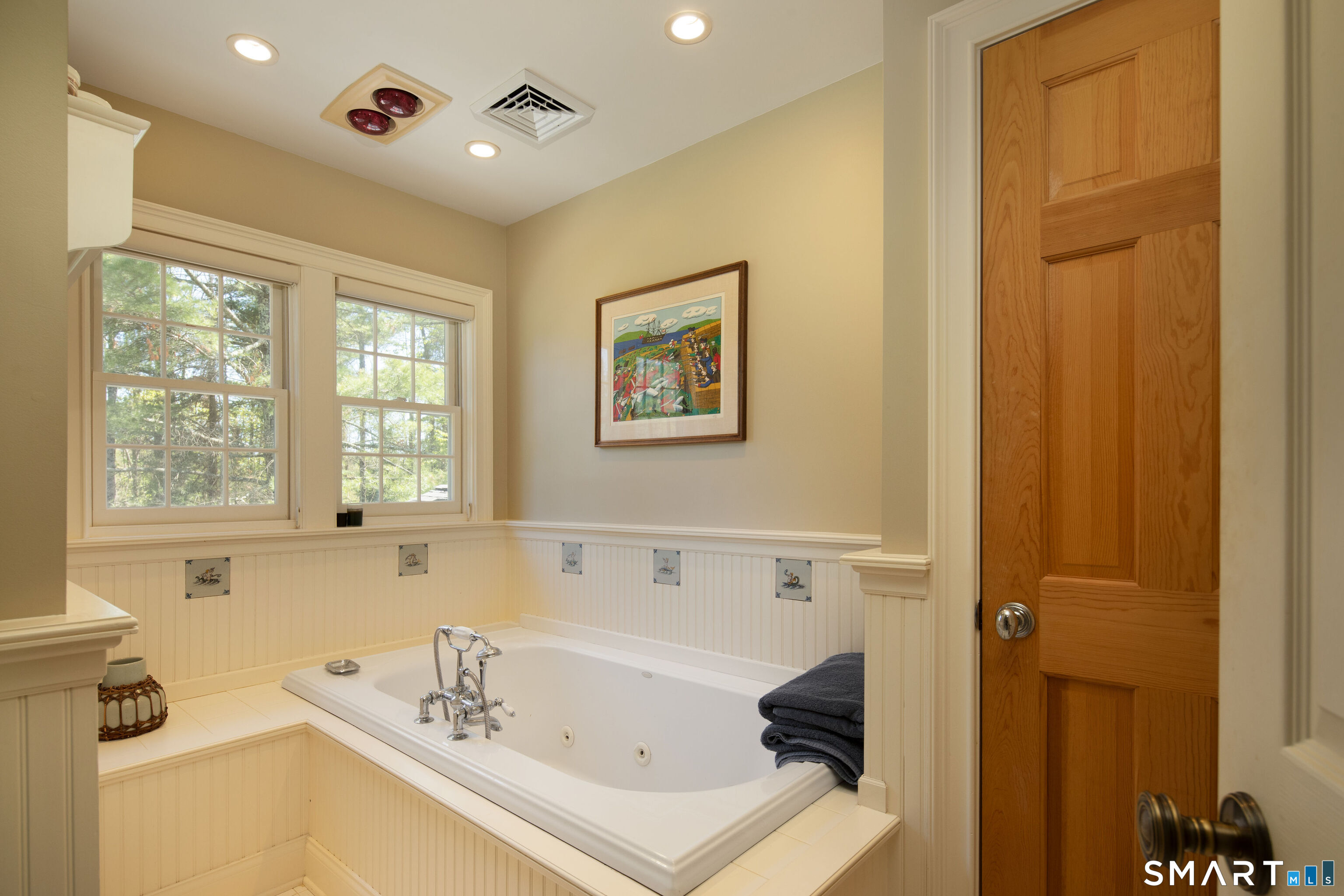 7 Cooper Hill Road Salisbury, CT 06068 - Photo 27 of 36 a bathroom with a tub a sink and a window