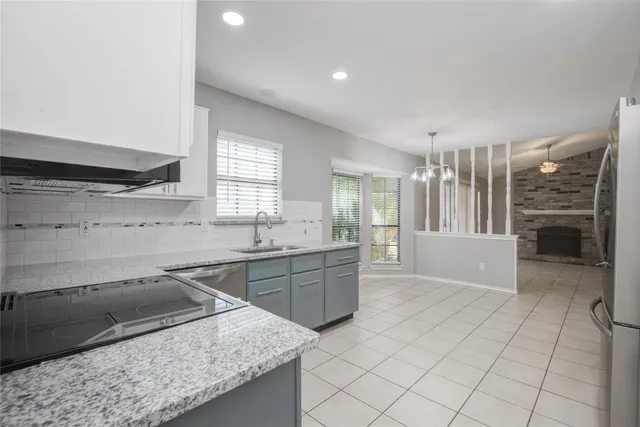 a kitchen with a sink and cabinets