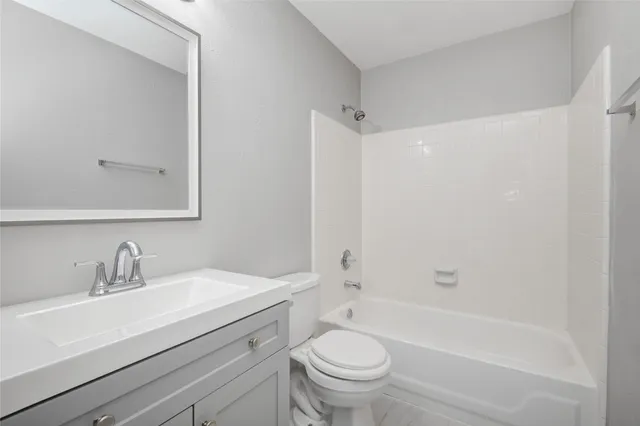 a bathroom with a sink a toilet and a bathtub