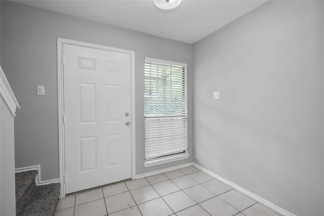 a view of an empty room and window