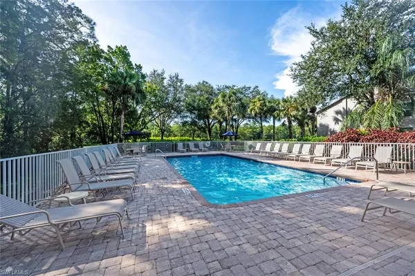 a view of a backyard with sitting area