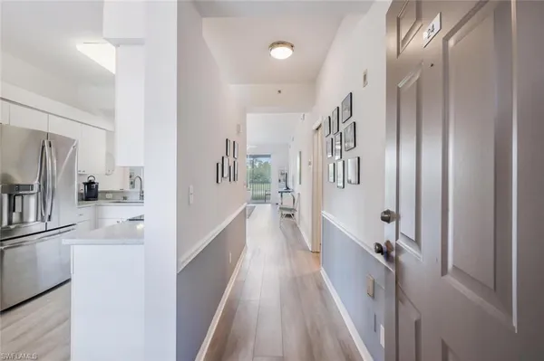 a view of a kitchen with a refrigerator
