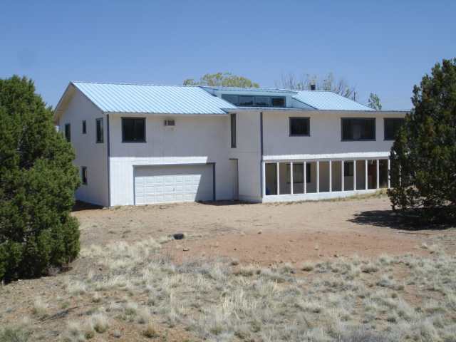 76 Freedom Lane Taylor, AZ 85939 - Photo 1 of 5 a front view of a house with a yard