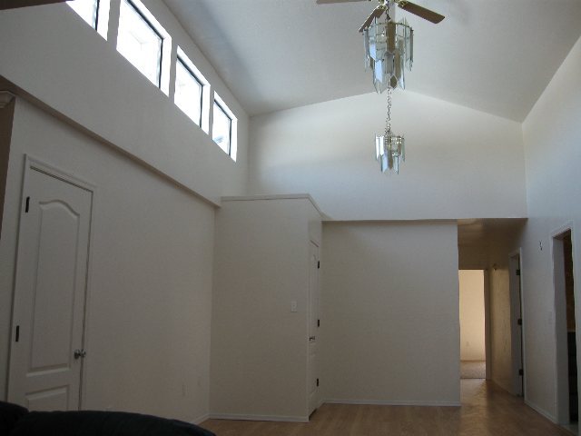 76 Freedom Lane Taylor, AZ 85939 - Photo 3 of 5 a view of a hallway with a chandelier