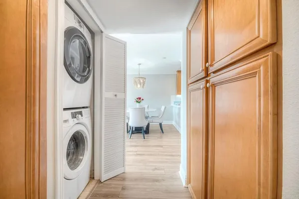 a view of a hallway with washer and dryer