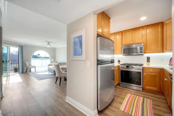 a kitchen with a sink appliances and cabinets