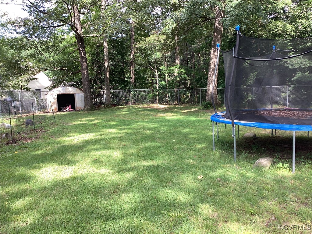 4433 Branchester Parkway Prince George, VA 23875 - Photo 14 of 29 View of yard featuring a trampoline