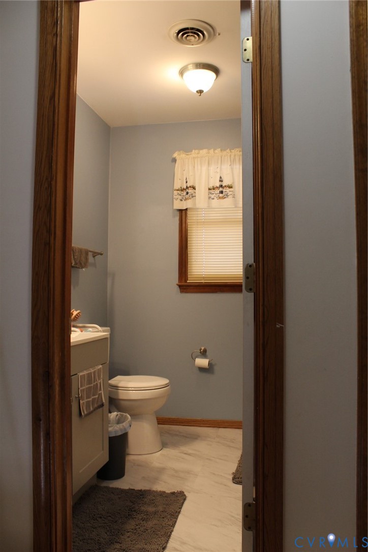 4433 Branchester Parkway Prince George, VA 23875 - Photo 26 of 29 Half bath featuring vanity and toilet