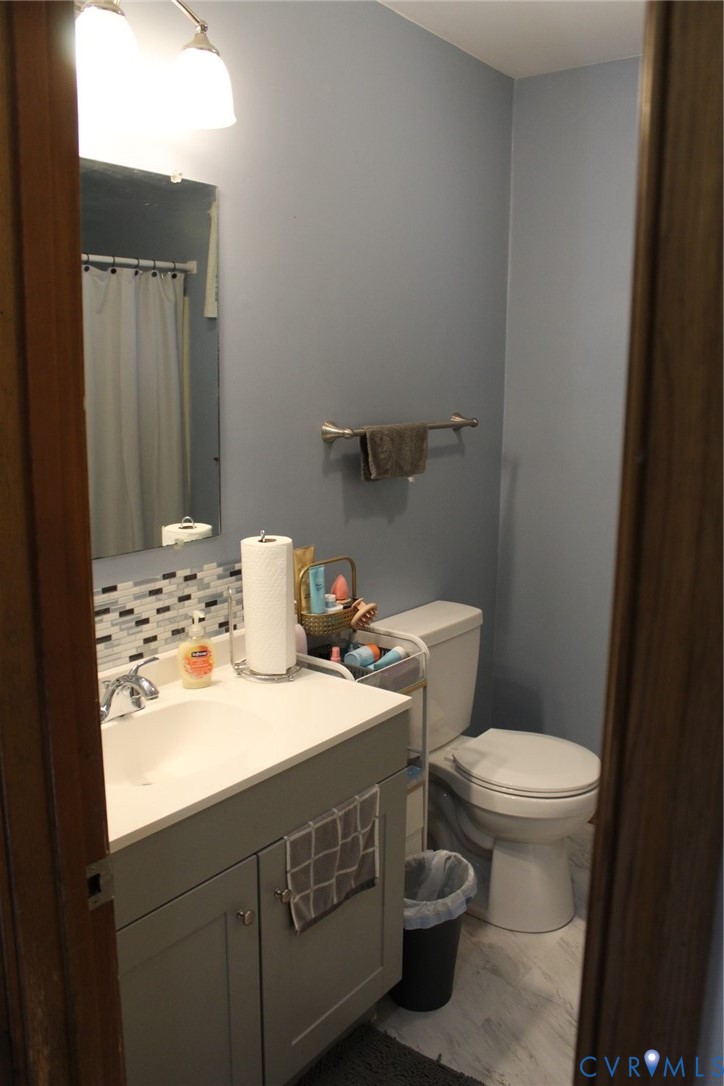 4433 Branchester Parkway Prince George, VA 23875 - Photo 27 of 29 Bathroom with vanity and curtained shower