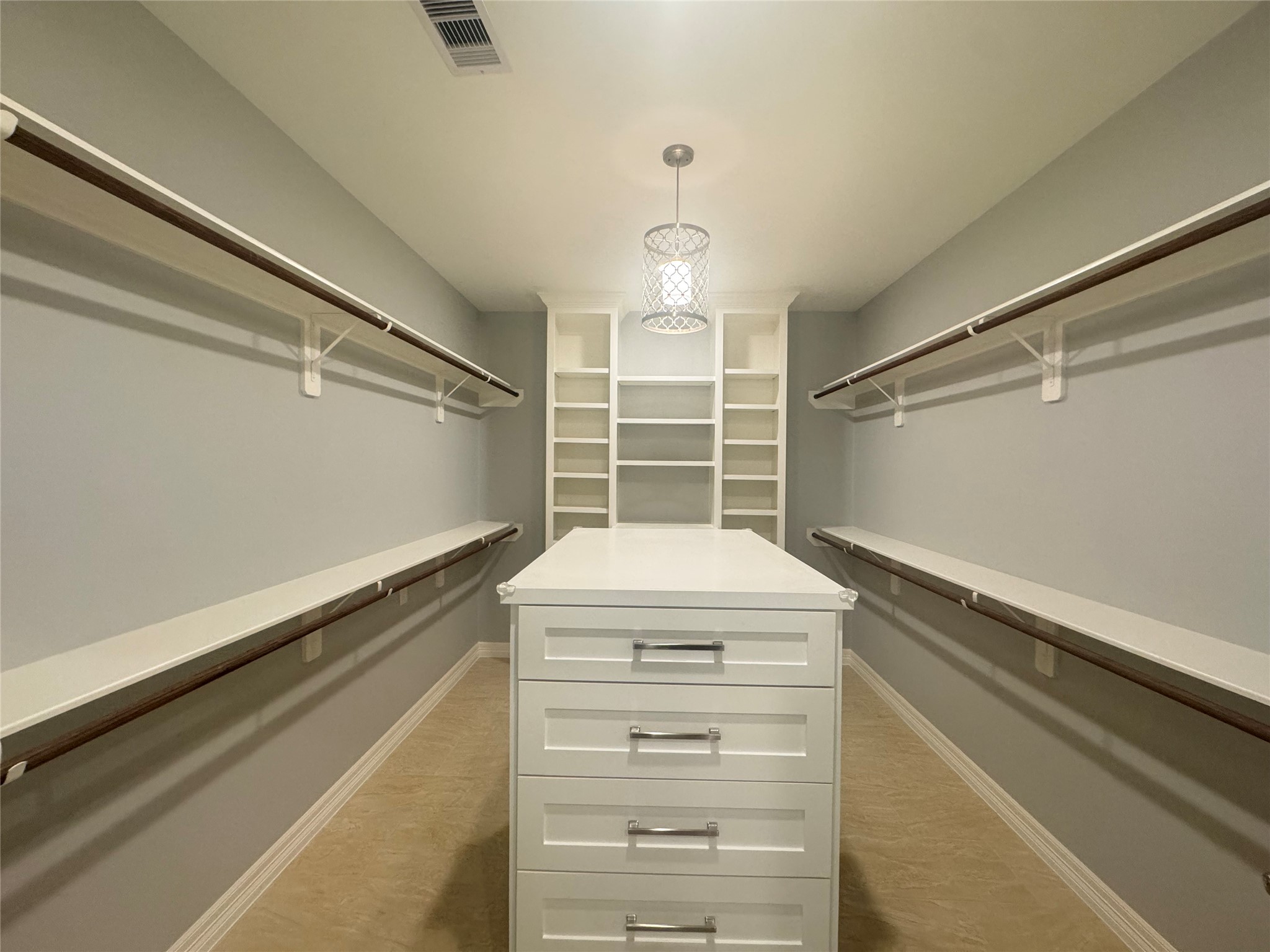 2010 Cherry Laurel Spring, TX 77386 - Photo 26 of 45 Huge walk-in closet with plenty of shelving and cabinets