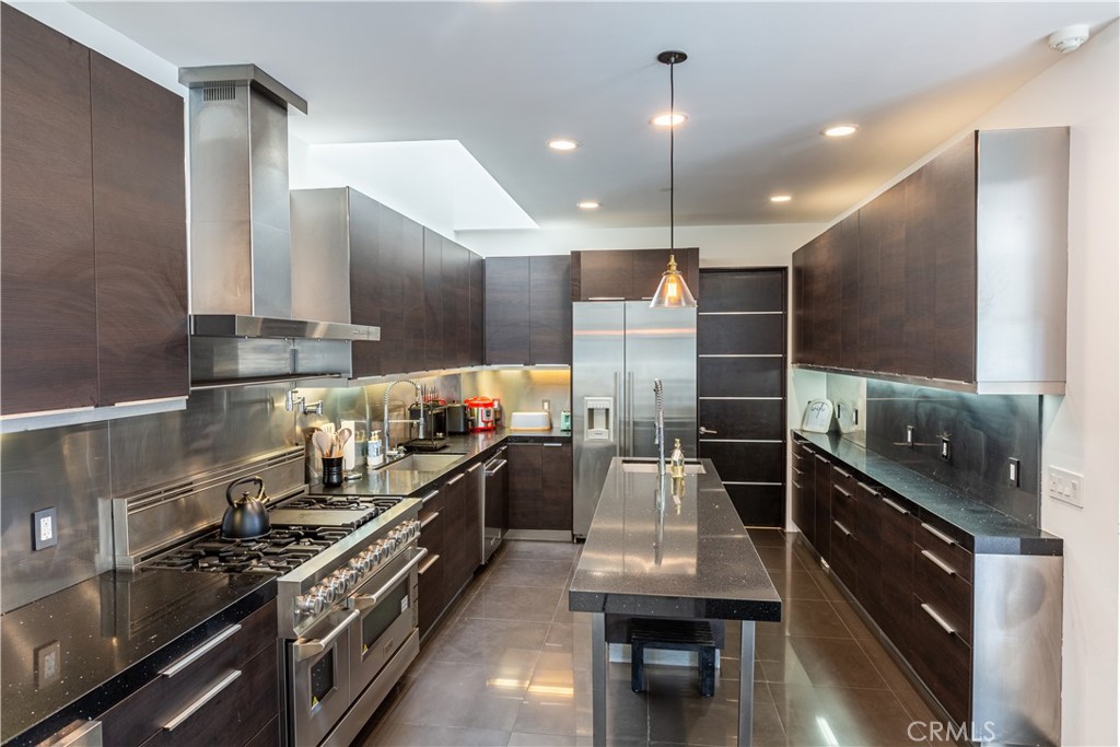 12148 Travis Street Los Angeles, CA 90049 - Photo 12 of 32 a kitchen with lots of counter top space