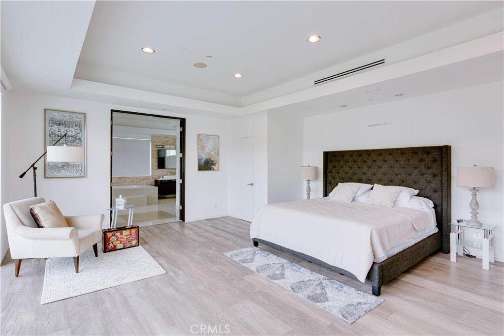 12148 Travis Street Los Angeles, CA 90049 - Photo 16 of 32 a bedroom with a bed and a couch