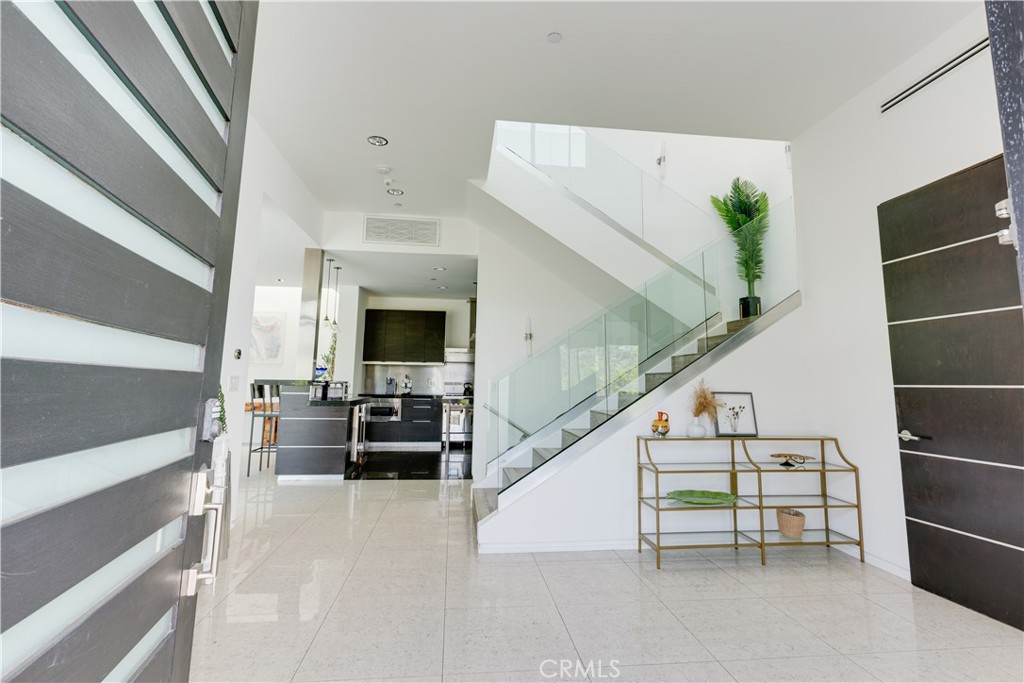 12148 Travis Street Los Angeles, CA 90049 - Photo 22 of 32 a view of living room with furniture and fireplace