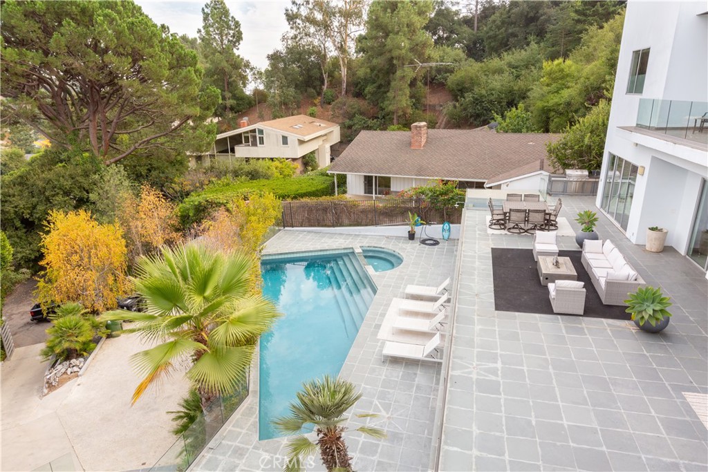 12148 Travis Street Los Angeles, CA 90049 - Photo 5 of 32 a view of a house with a yard