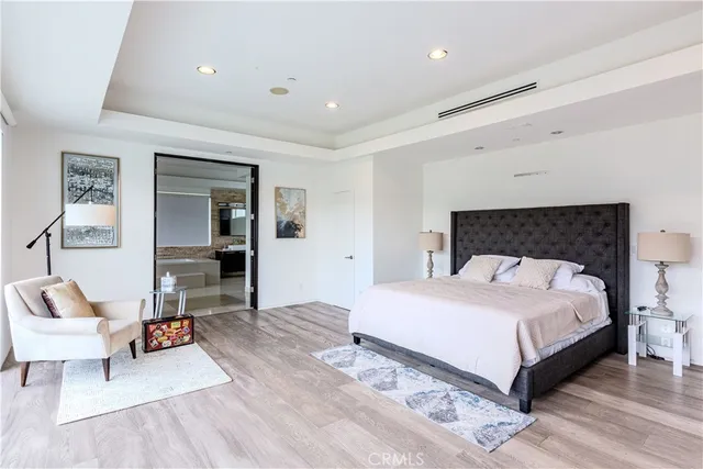 a bedroom with a bed and a couch