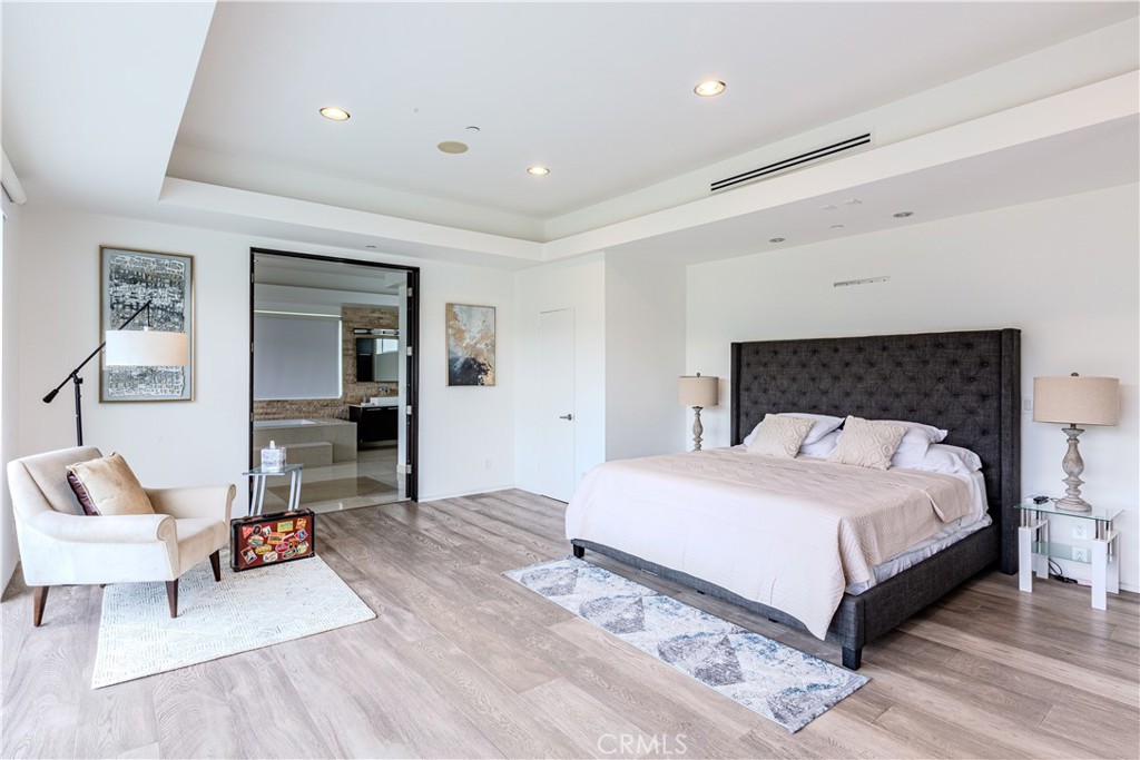 12148 Travis Street Los Angeles, CA 90049 - Photo 10 of 32 a bedroom with a bed and a couch