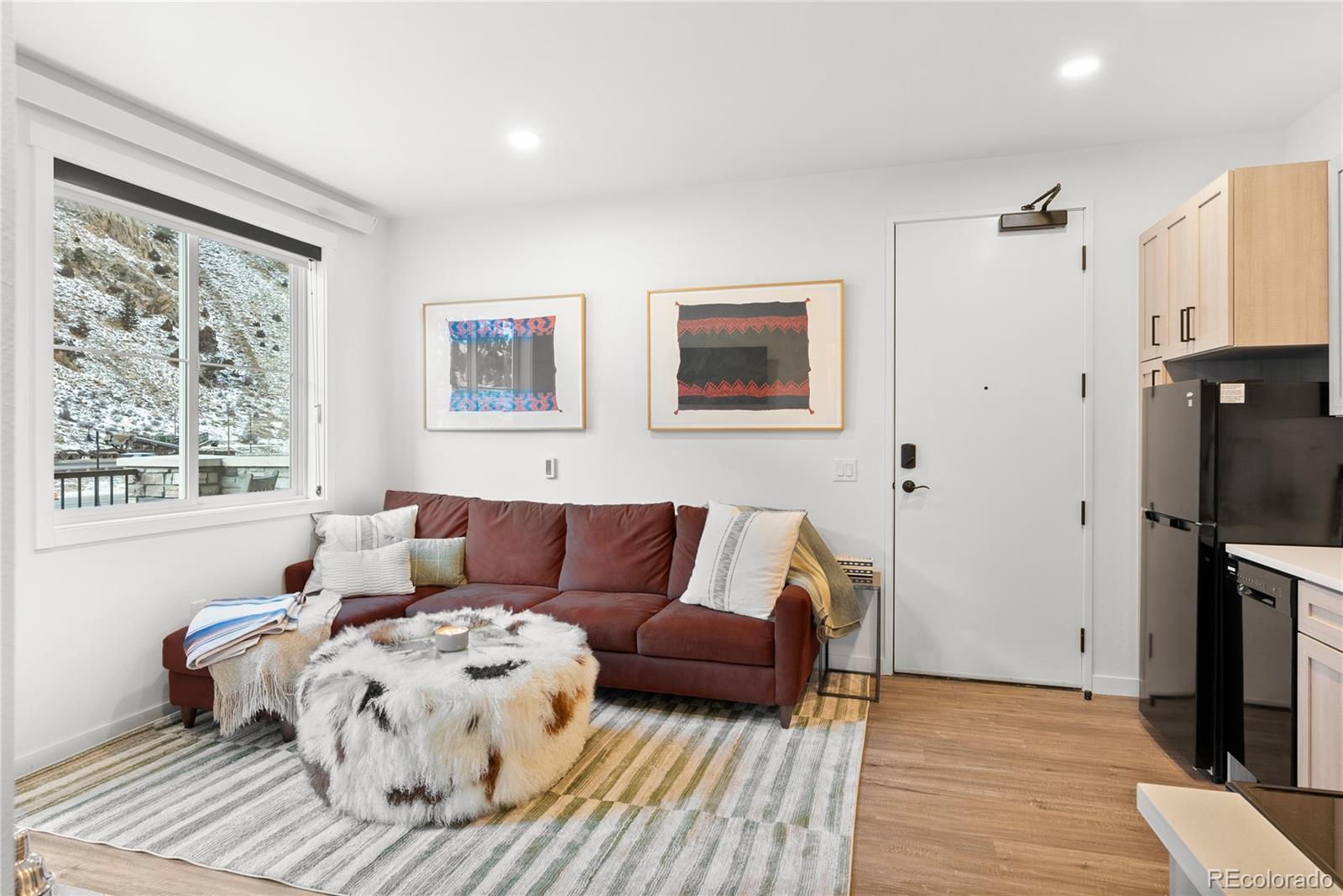 2121 Hummingbird Way, Unit 204 Georgetown, CO 80444 - Photo 10 of 36 a bed room with a bed and a couch