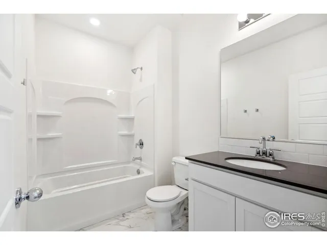 a bathroom with a sink a toilet and a bathtub
