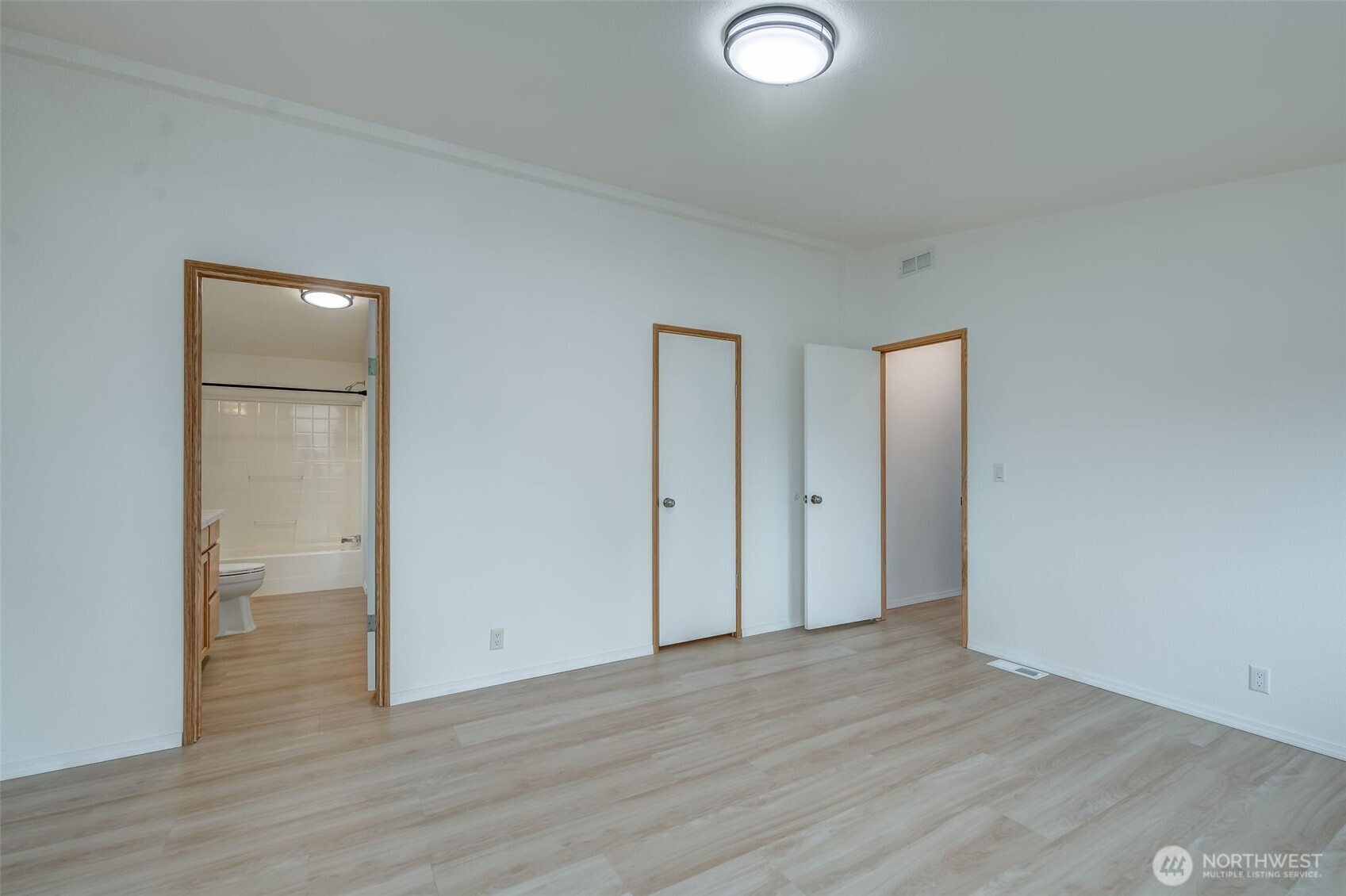1200 Gallers Street Wenatchee, WA 98801 - Photo 12 of 27 a view of a room with wooden floor and bathroom view