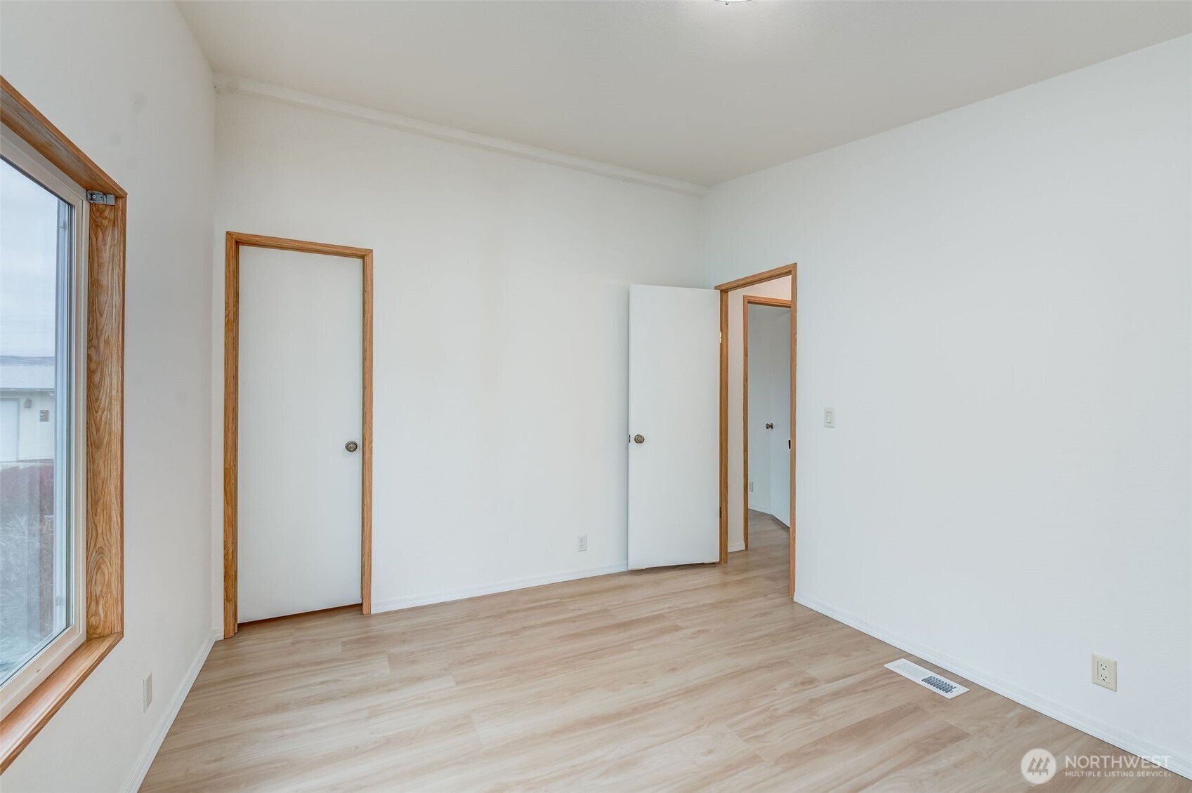 1200 Gallers Street Wenatchee, WA 98801 - Photo 17 of 27 a view of an empty room with wooden floor and a window