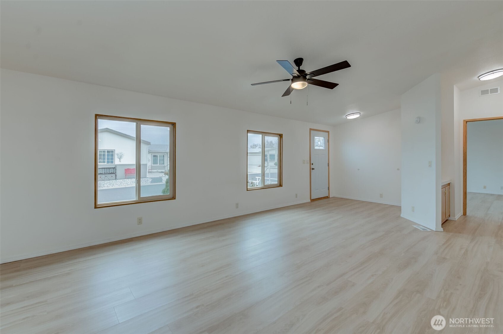 1200 Gallers Street Wenatchee, WA 98801 - Photo 5 of 27 a view of an empty room with a window and wooden floor