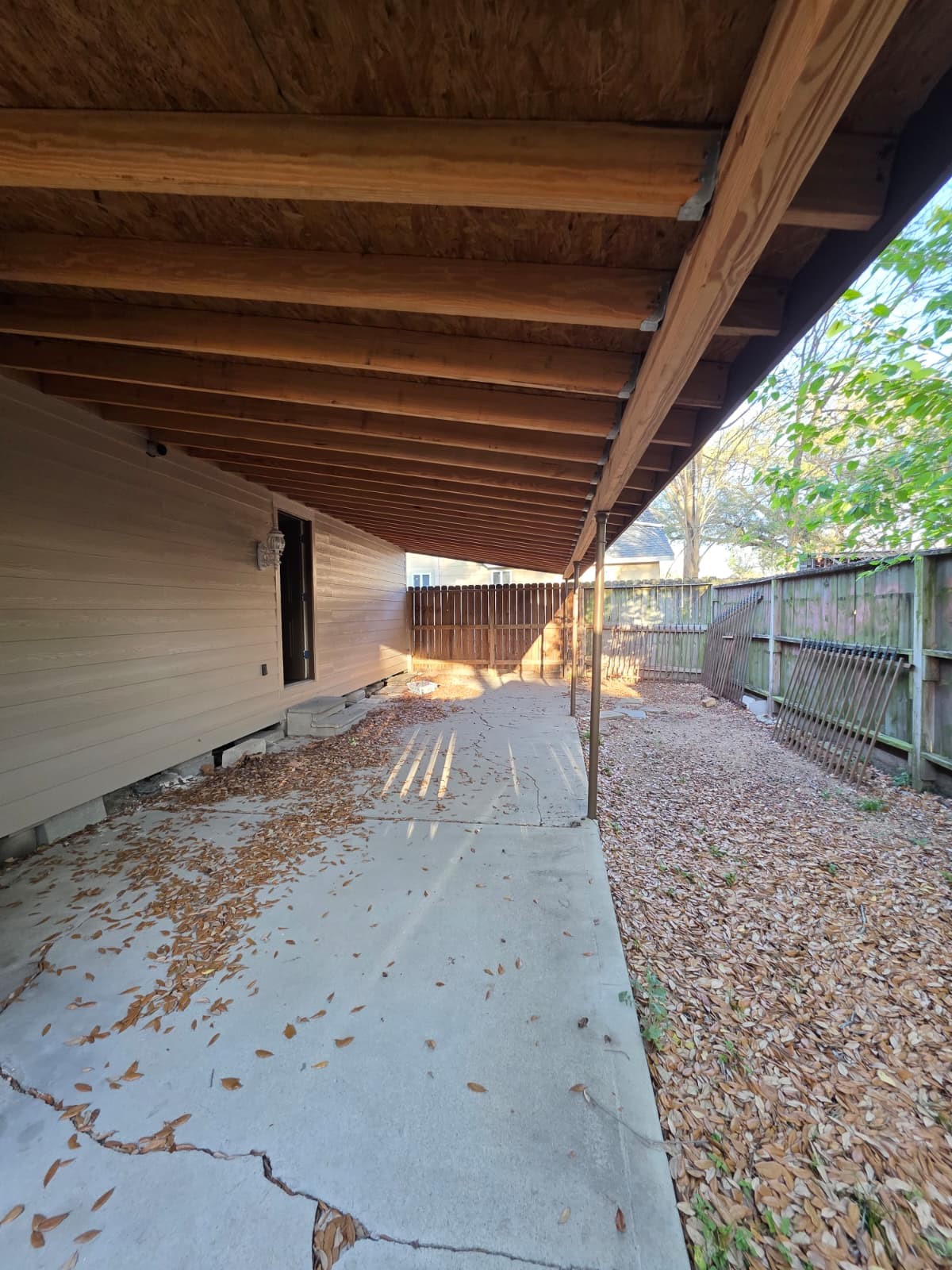 1720 Roxella Street Houston, TX 77093 - Photo 12 of 13 a view of a backyard with wooden fence