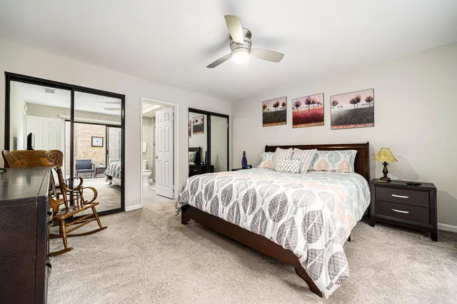 a bedroom with a bed and a tv