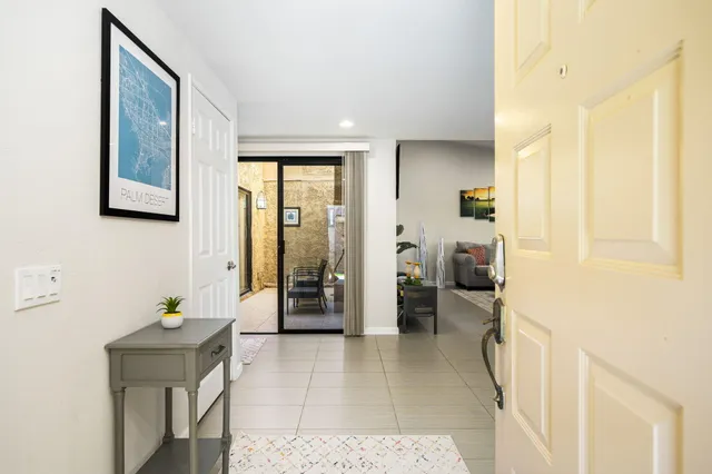 a living room with furniture and a table
