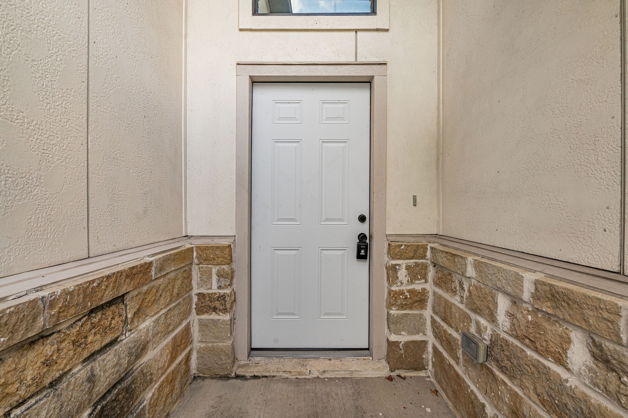 6838 Foster Street Houston, TX 77021 - Photo 4 of 24 Convenient rear entry with tile flooring and decorative stone accents