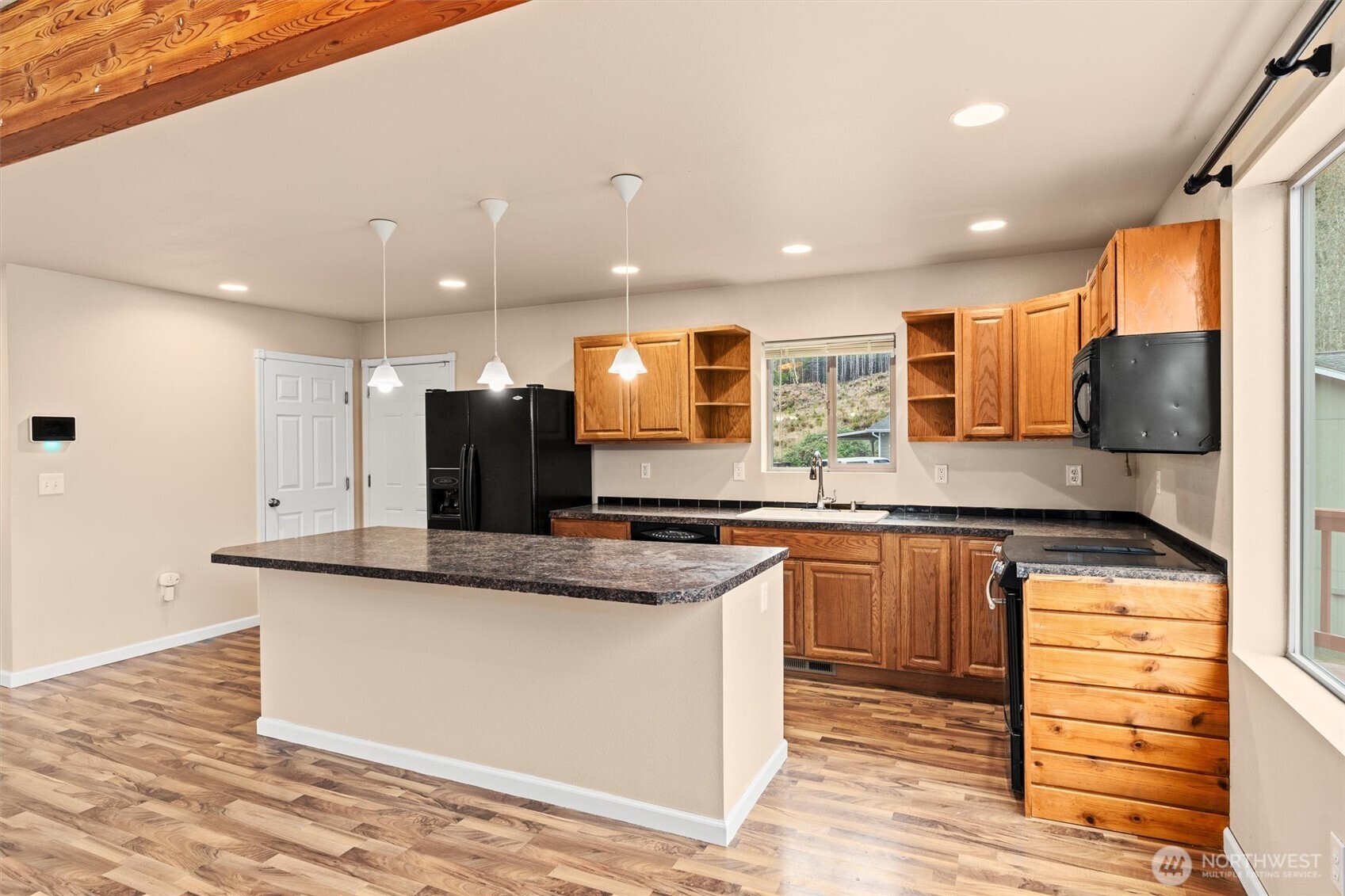 120 West Prairie Loop Road Elma, WA 98541 - Photo 12 of 40 a kitchen with stainless steel appliances granite countertop a sink and a stove