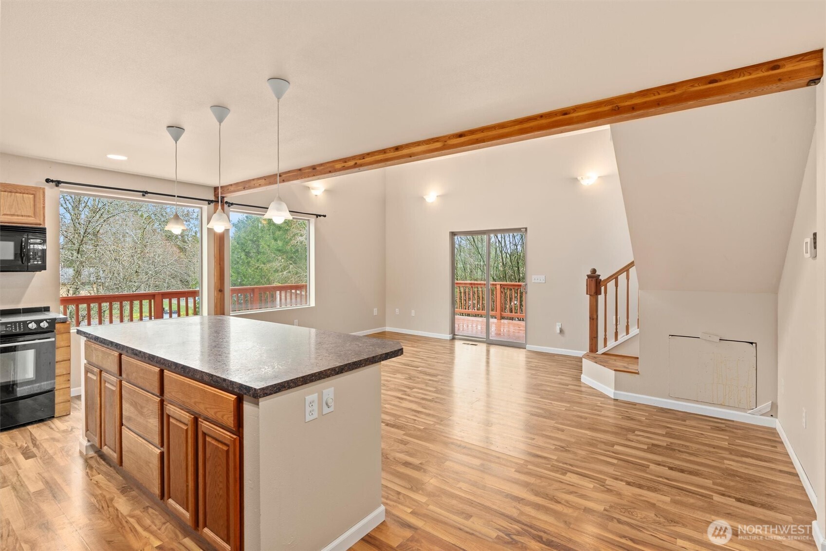 120 West Prairie Loop Road Elma, WA 98541 - Photo 15 of 40 a kitchen with stainless steel appliances granite countertop a sink and wooden floor