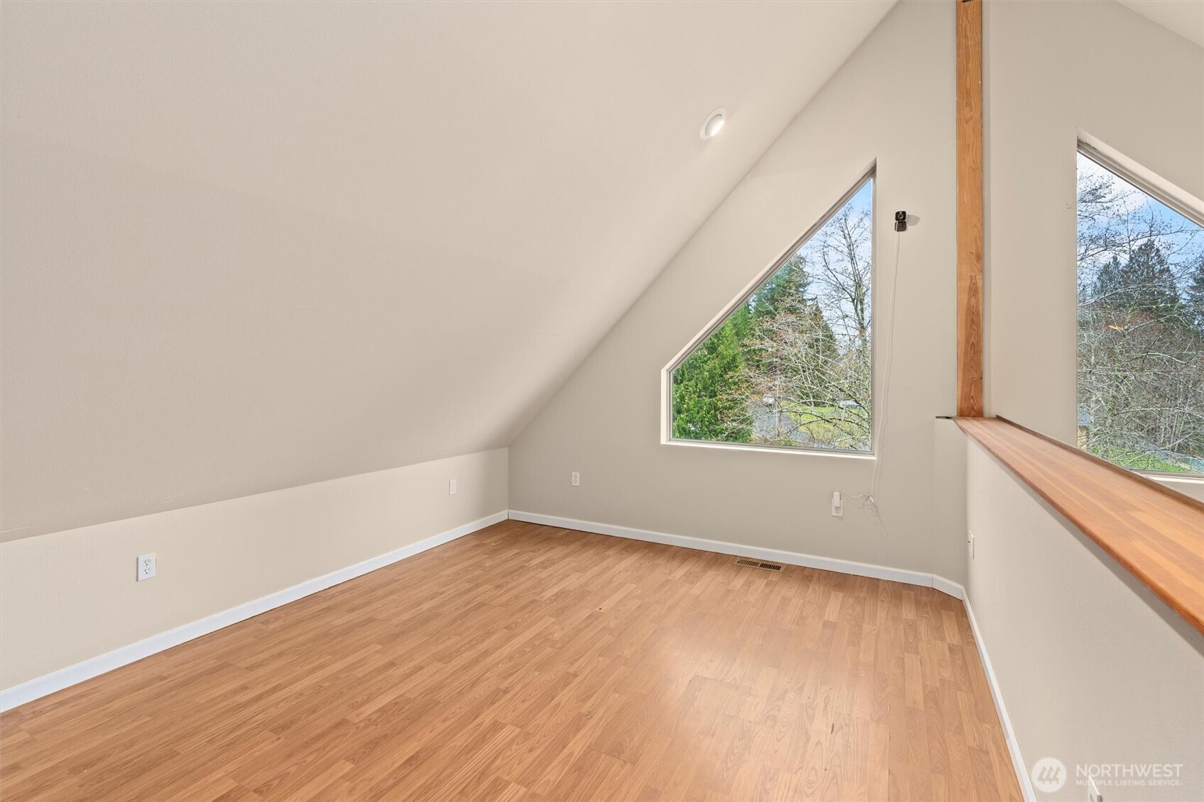 120 West Prairie Loop Road Elma, WA 98541 - Photo 22 of 40 a view of an empty room with wooden floor and a window