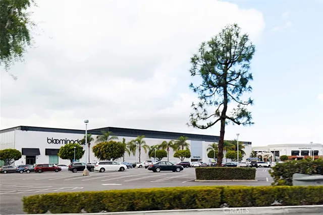 a view of a swimming pool with a backyard and trees