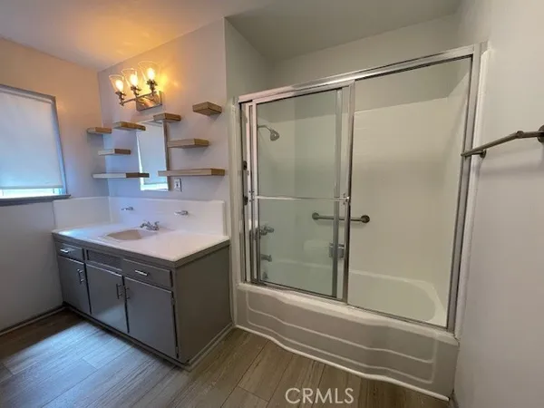 a bathroom with a sink and mirror