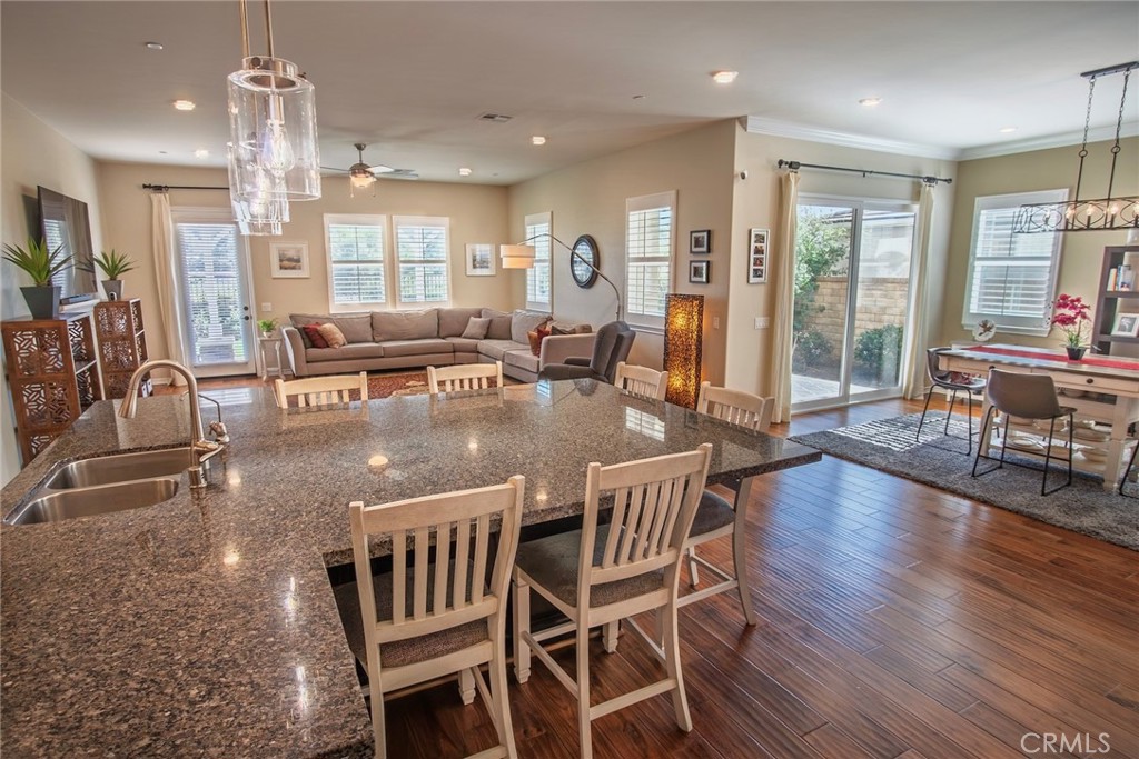 26424 Township Street Saugus, CA 91350 - Photo 13 of 72 a view of a dining room and livingroom with furniture wooden floor a chandelier