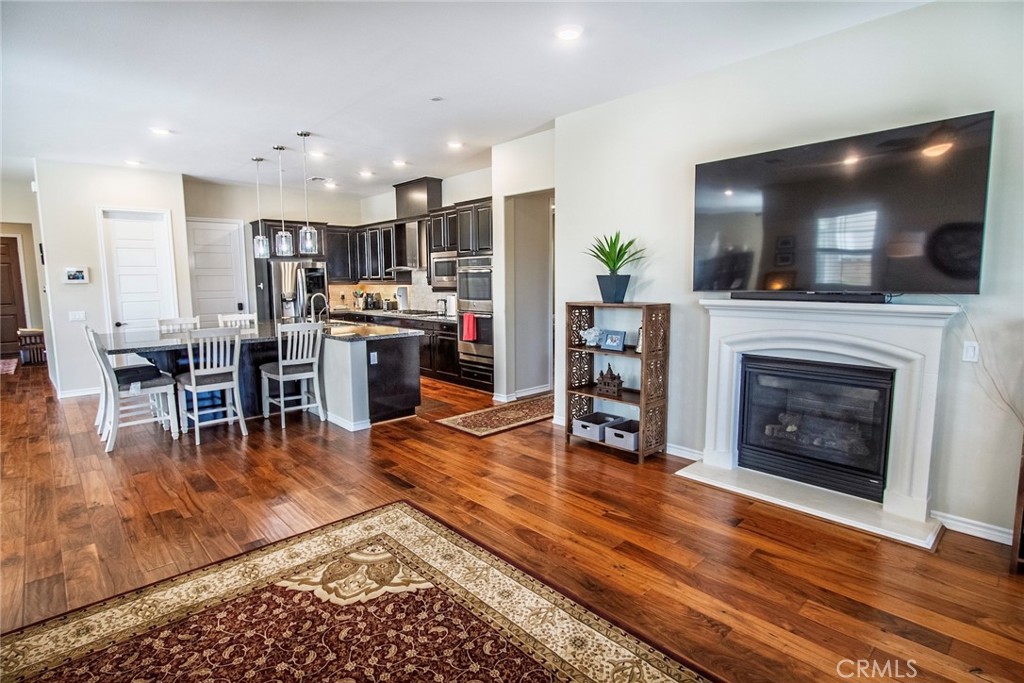 26424 Township Street Saugus, CA 91350 - Photo 17 of 72 a living room with furniture a flat screen tv and a fireplace