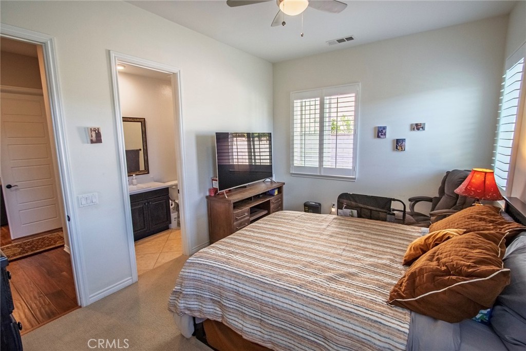 26424 Township Street Saugus, CA 91350 - Photo 21 of 72 a bedroom with a bed and a flat screen tv