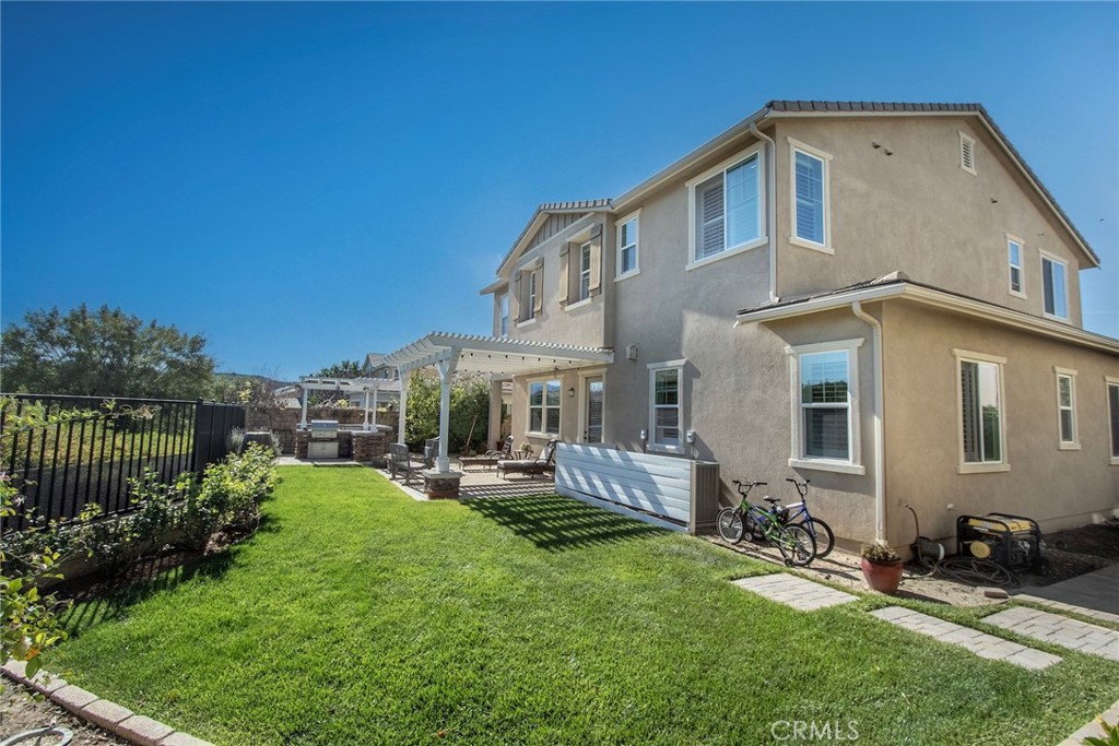 26424 Township Street Saugus, CA 91350 - Photo 28 of 72 a front view of house with yard and outdoor seating