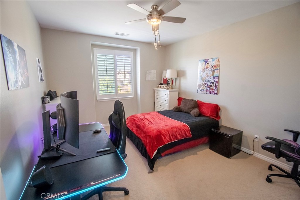 26424 Township Street Saugus, CA 91350 - Photo 39 of 72 a bedroom with a bed and a desk