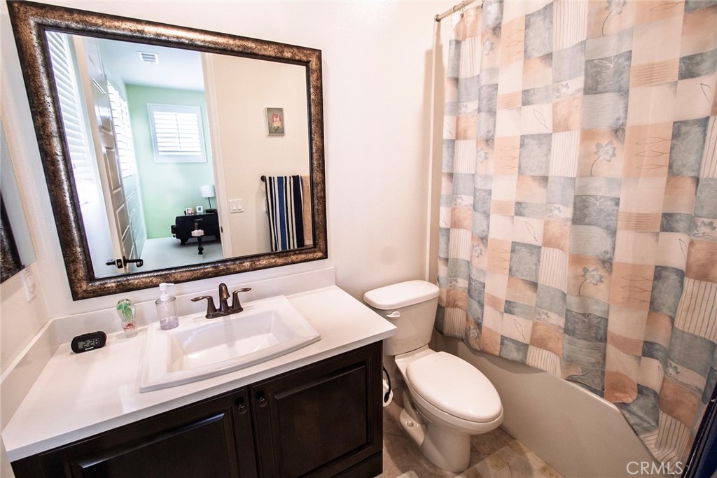 26424 Township Street Saugus, CA 91350 - Photo 42 of 72 a bathroom with a sink and a mirror
