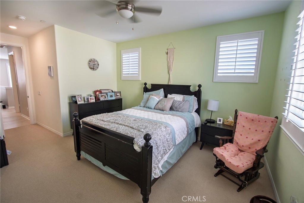 26424 Township Street Saugus, CA 91350 - Photo 44 of 72 a bedroom with a bed and a chandelier