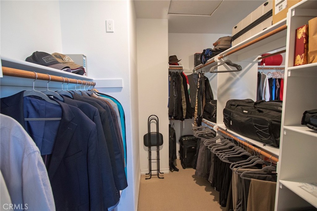 26424 Township Street Saugus, CA 91350 - Photo 53 of 72 a view of walk in closet with clothes and shoes