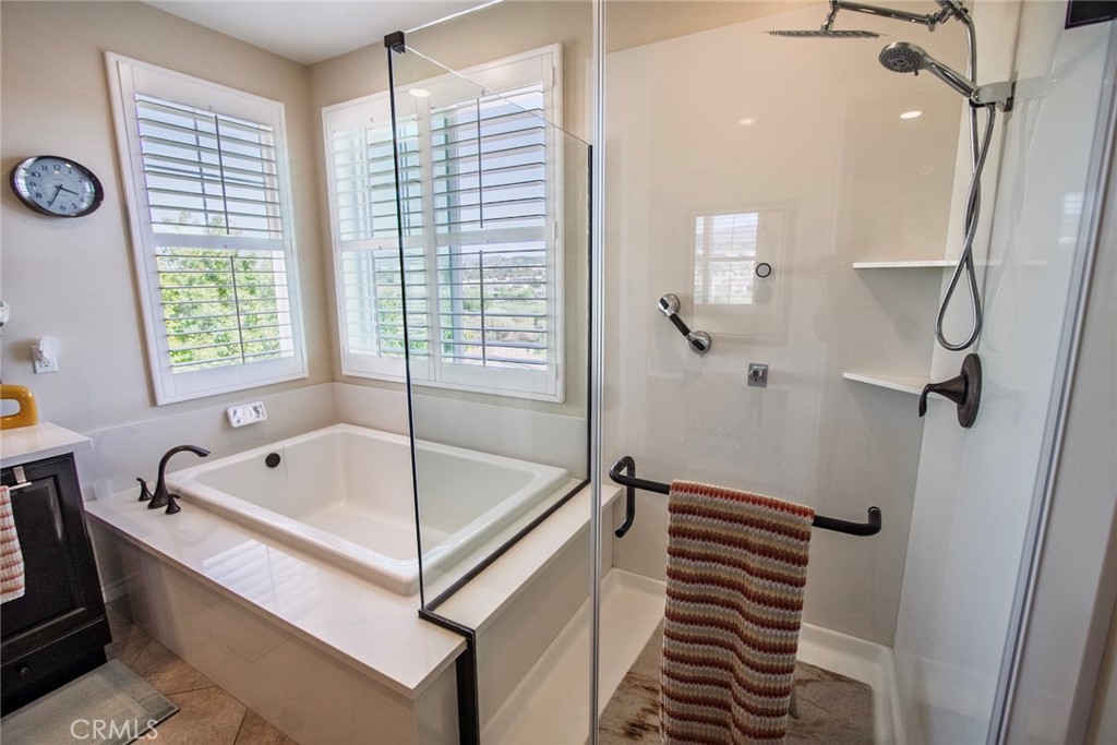 26424 Township Street Saugus, CA 91350 - Photo 54 of 72 a bathroom with a tub a sink and a window